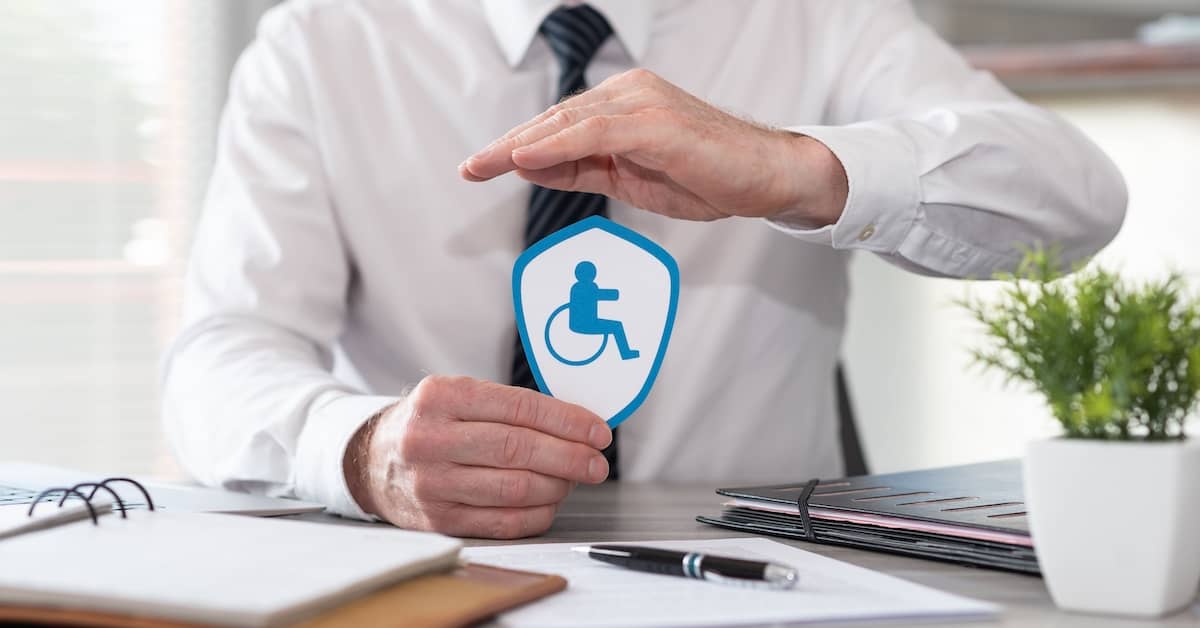 Insurer holding a badge symbolising Total and Permanent Disability (TPD) | TPD Compensation Lawyers